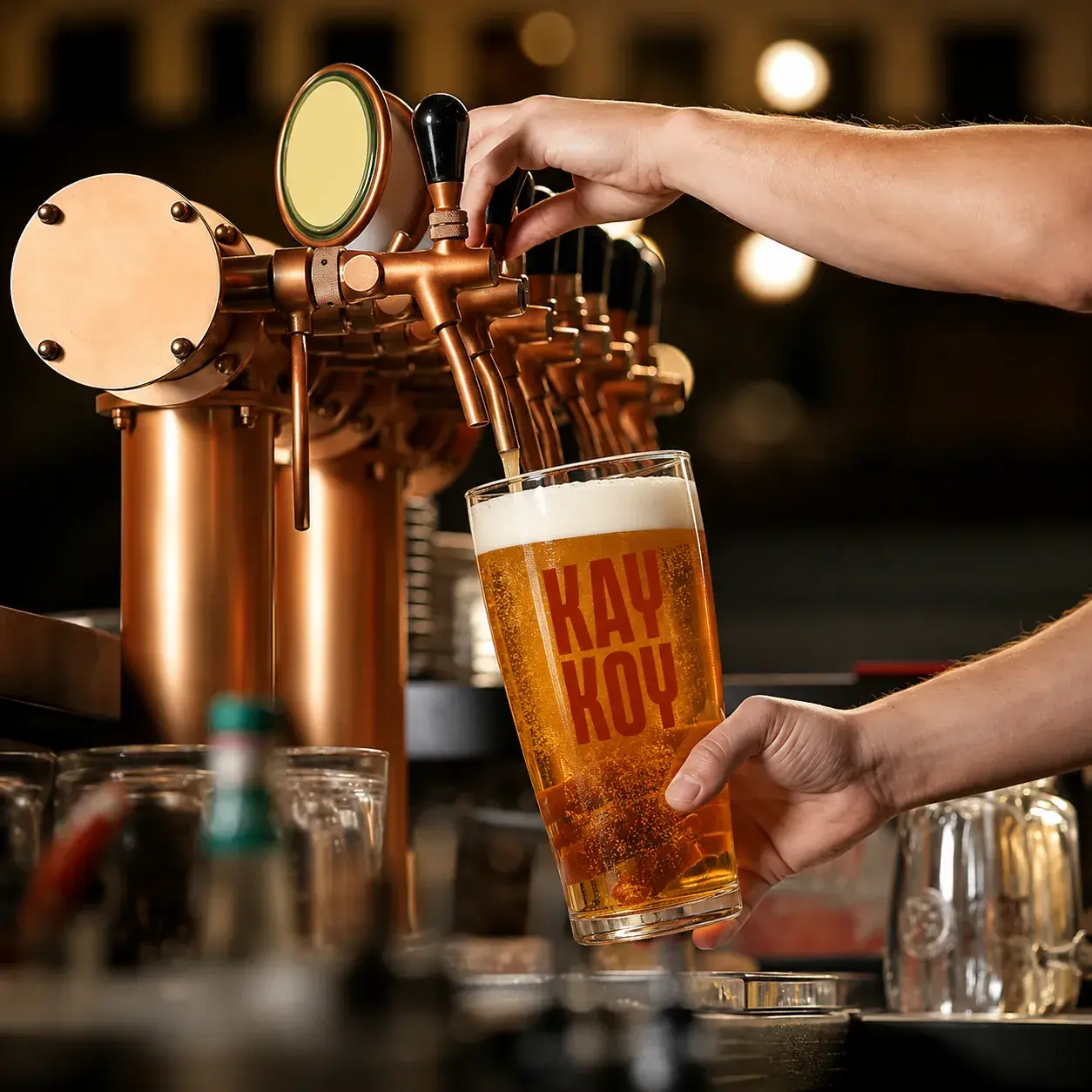 A Kay Koy pour being handed across the bar